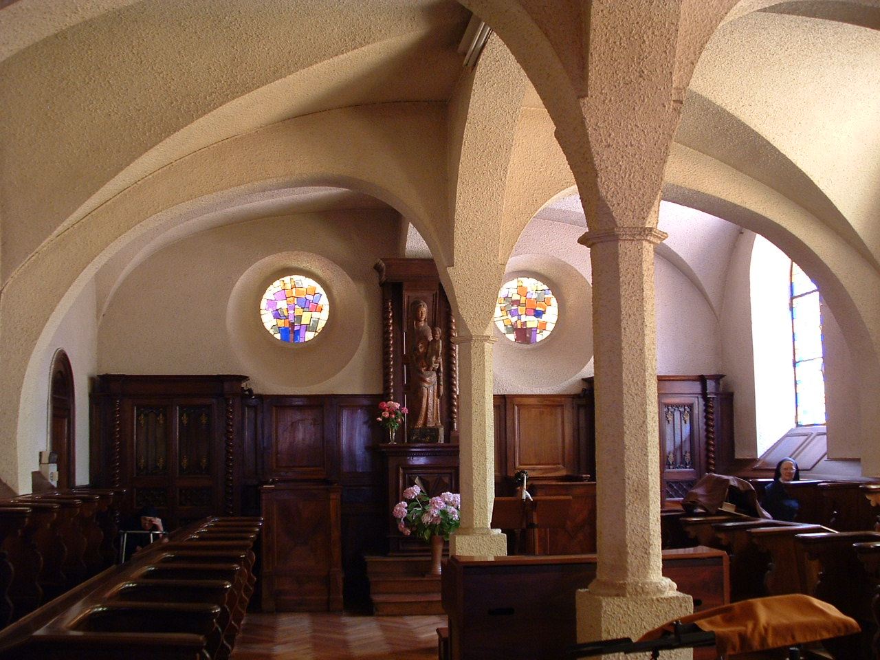 The vaulted choir of the chapel of Saint-Pierre and its stalls