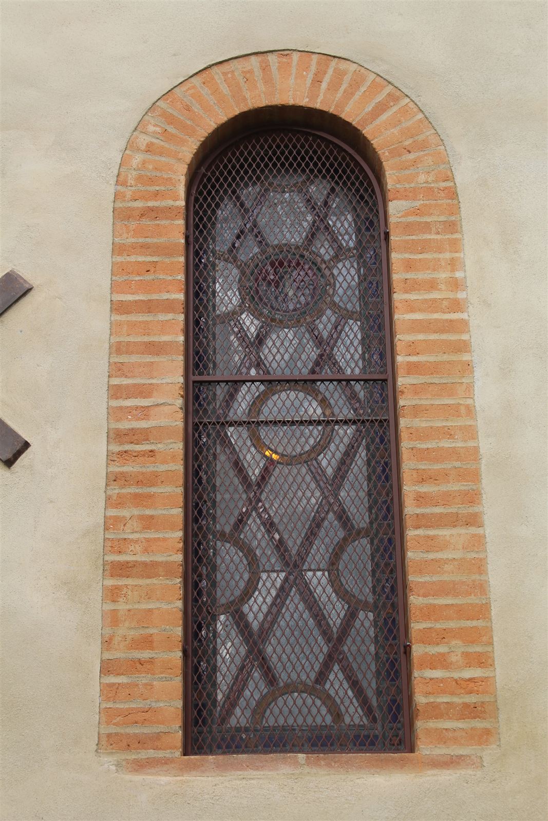 Round-arched window with a brick surround