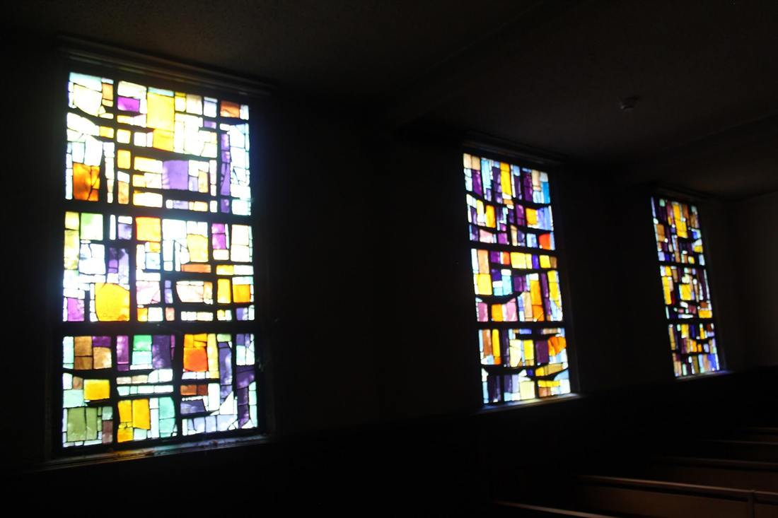 Coloured stained glass in the half-light